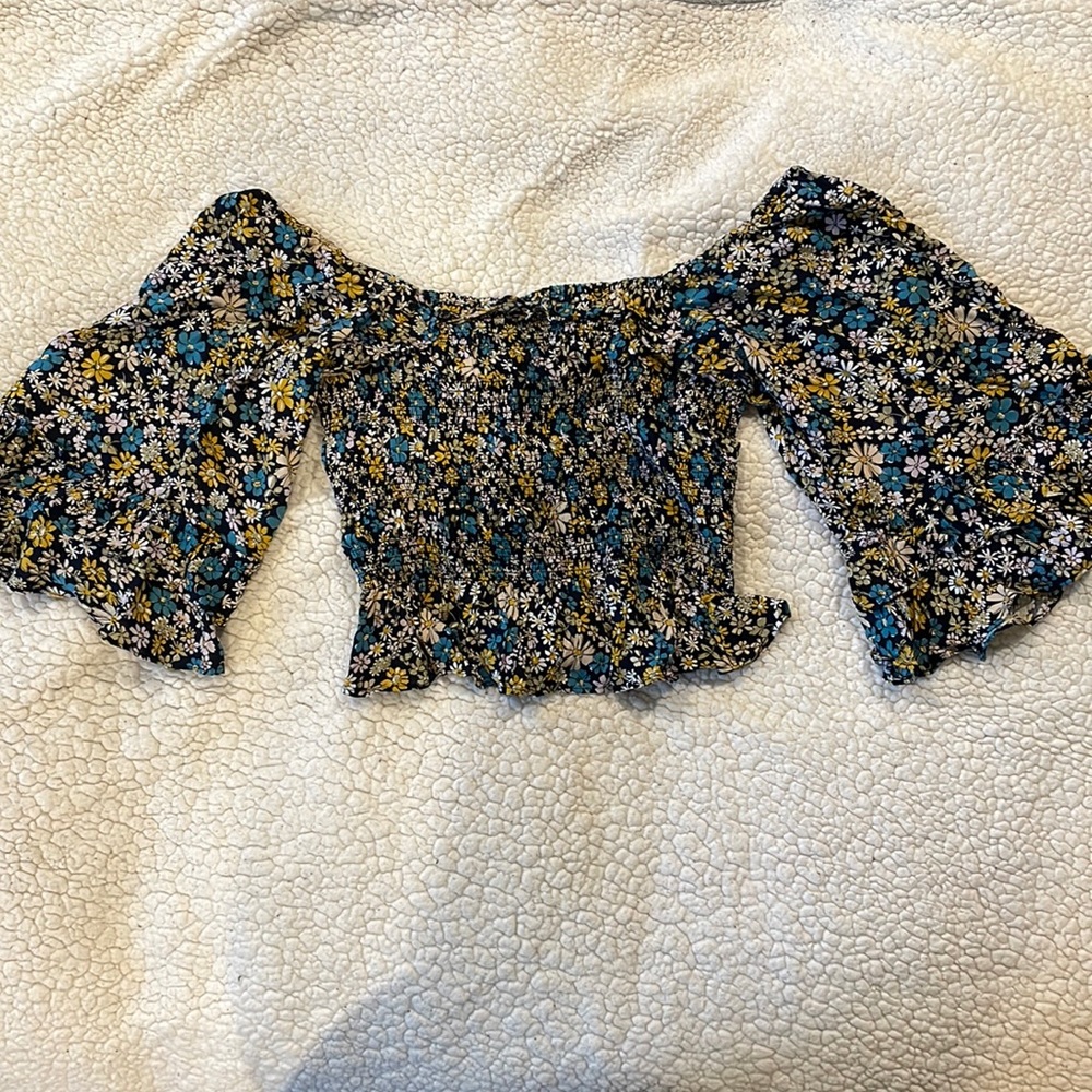 Floral blouse with white, blue, and yellow flowers